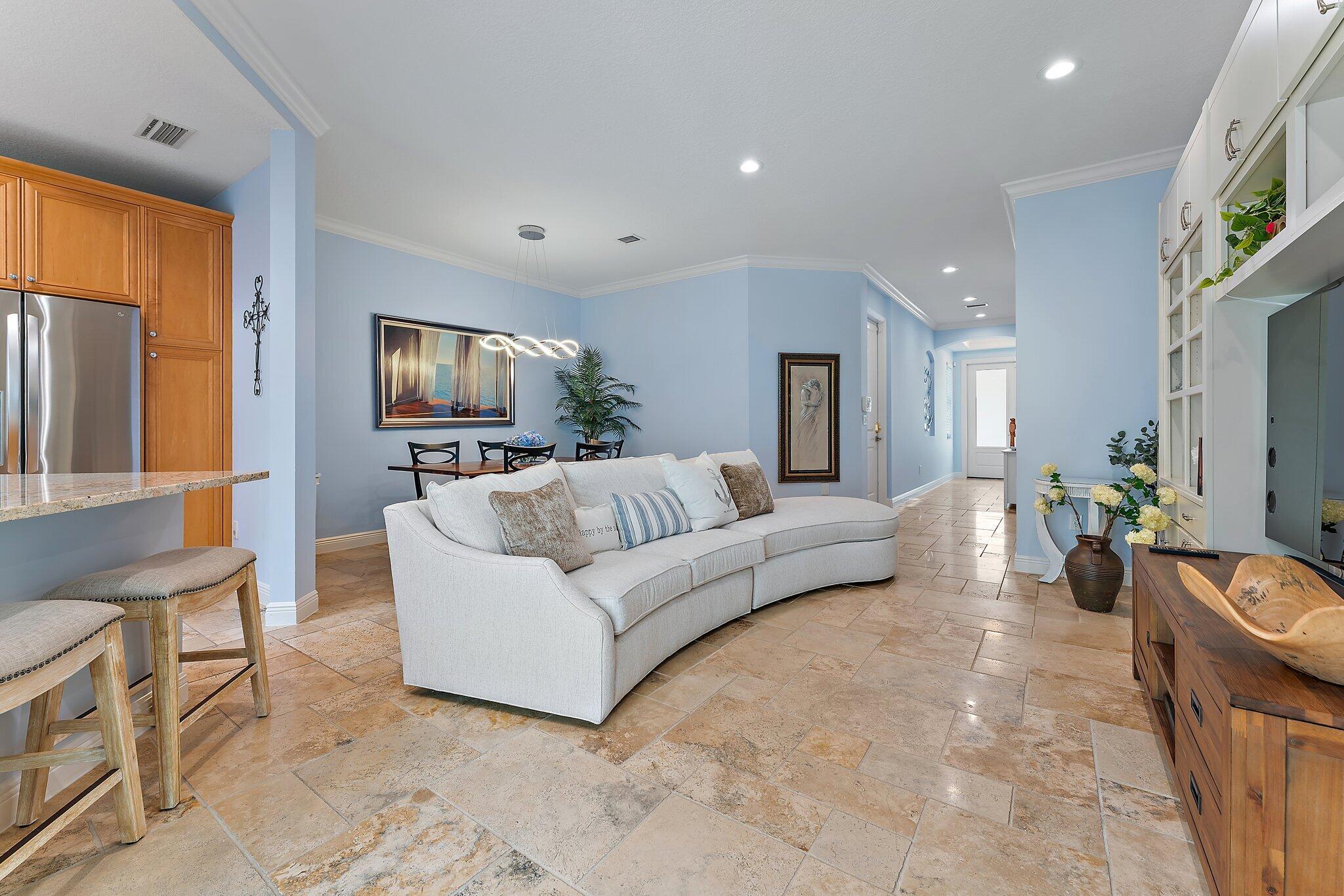 455 Ocean Ridge Way Juno Beach, FL 33408 - Photo 13 of 39 a living room with furniture and a flat screen tv