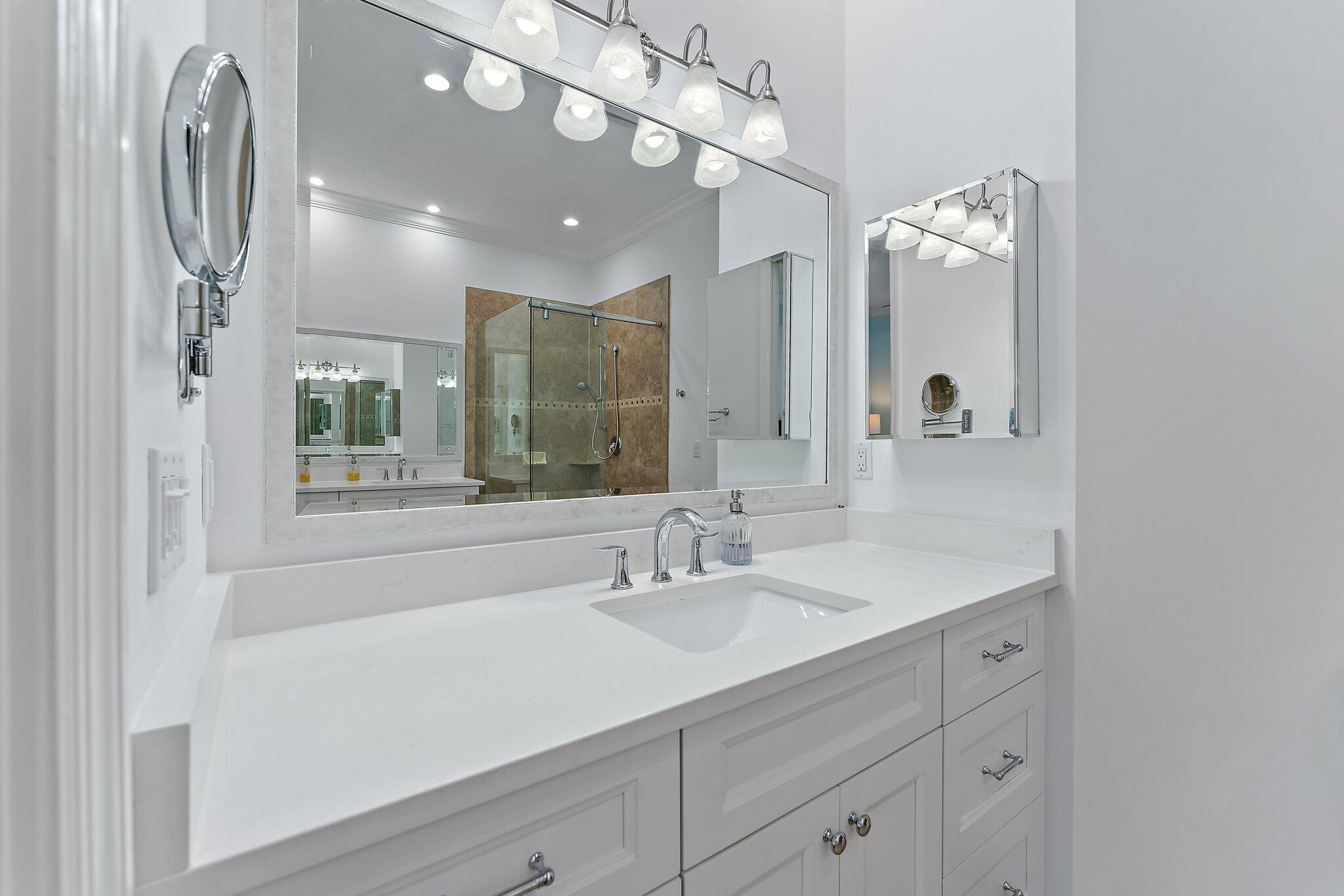455 Ocean Ridge Way Juno Beach, FL 33408 - Photo 28 of 39 a bathroom with a sink double vanity and a mirror