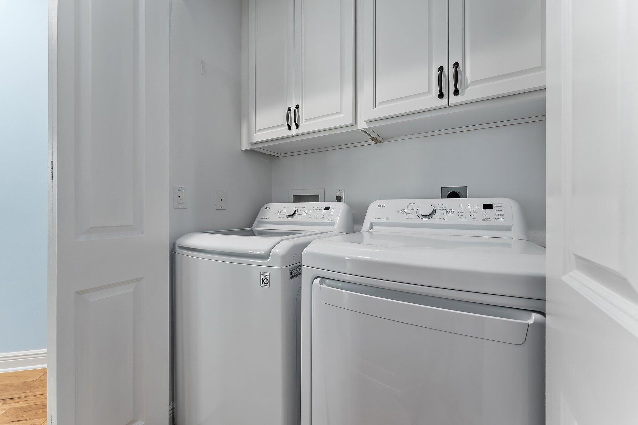 455 Ocean Ridge Way Juno Beach, FL 33408 - Photo 31 of 39 a utility room with dryer and washer