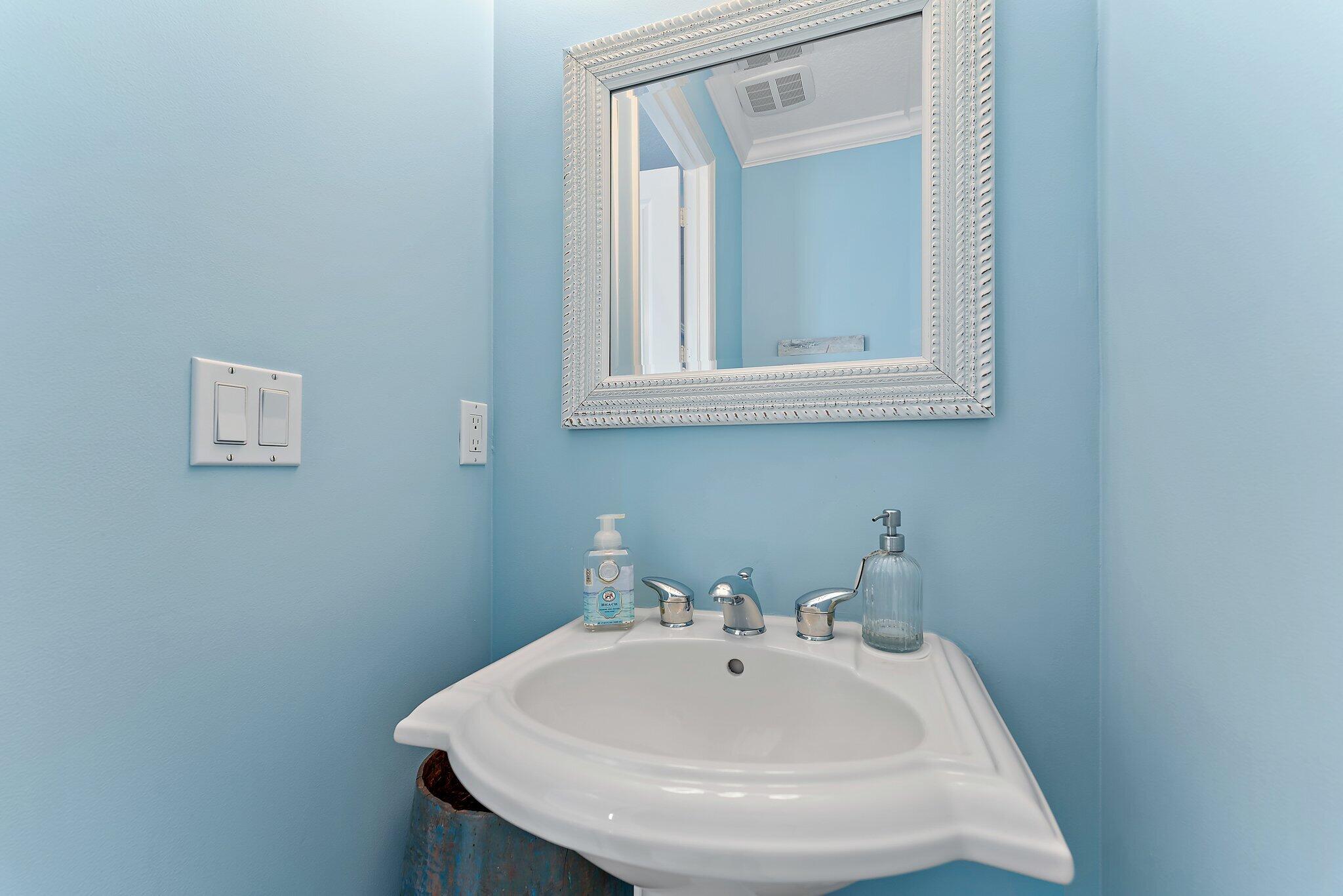 455 Ocean Ridge Way Juno Beach, FL 33408 - Photo 9 of 39 a bathroom with a sink and a mirror