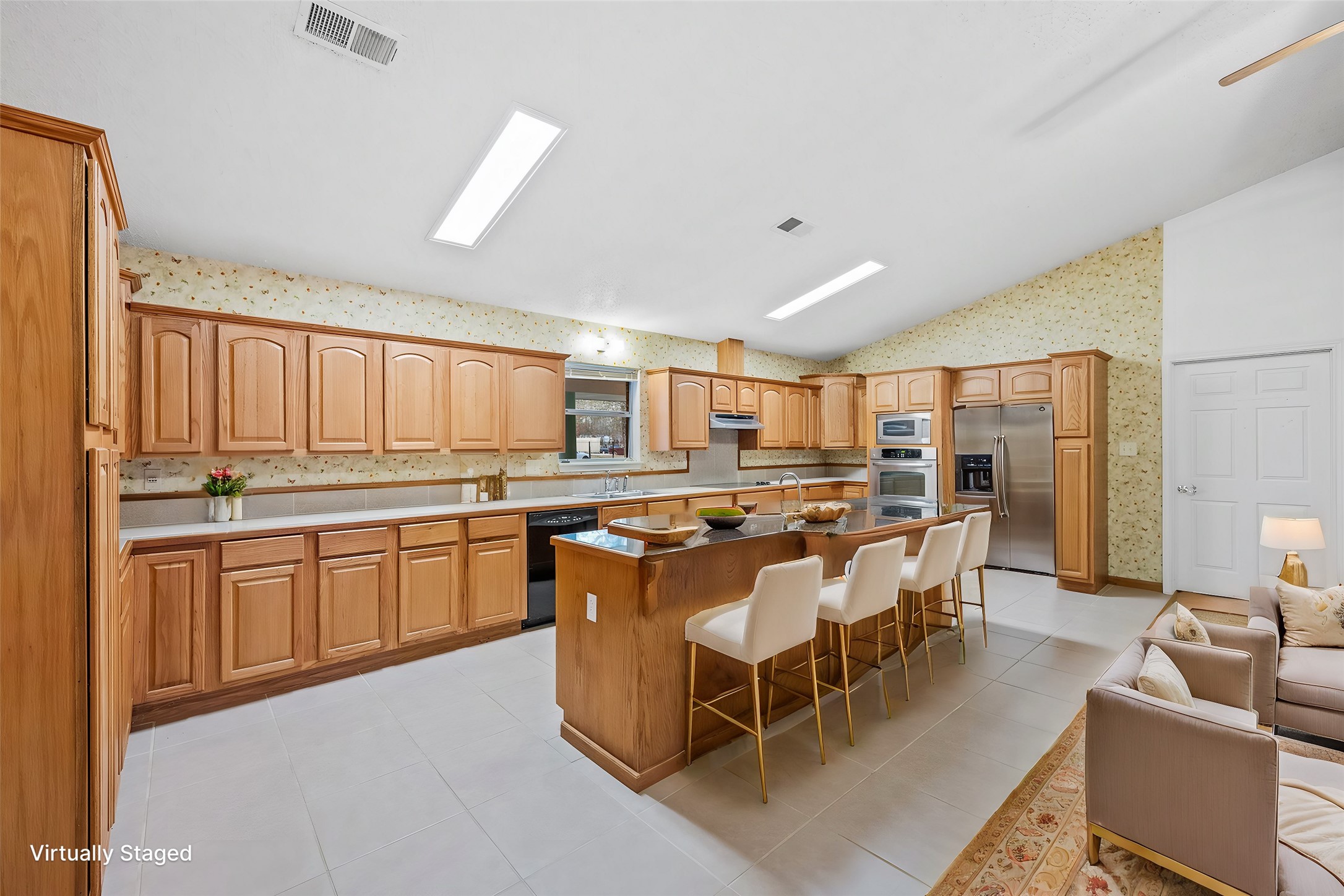 121 Magnolia Boulevard New Caney, TX 77357 - Photo 10 of 39 a kitchen with a large counter top space a sink appliances and cabinets