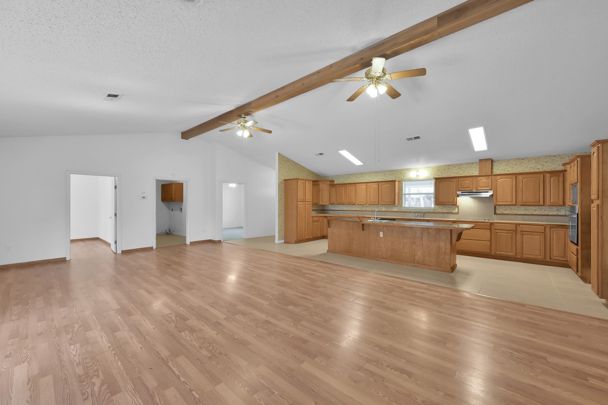 121 Magnolia Boulevard New Caney, TX 77357 - Photo 15 of 39 a view of a kitchen with a sink stainless steel appliances and cabinets