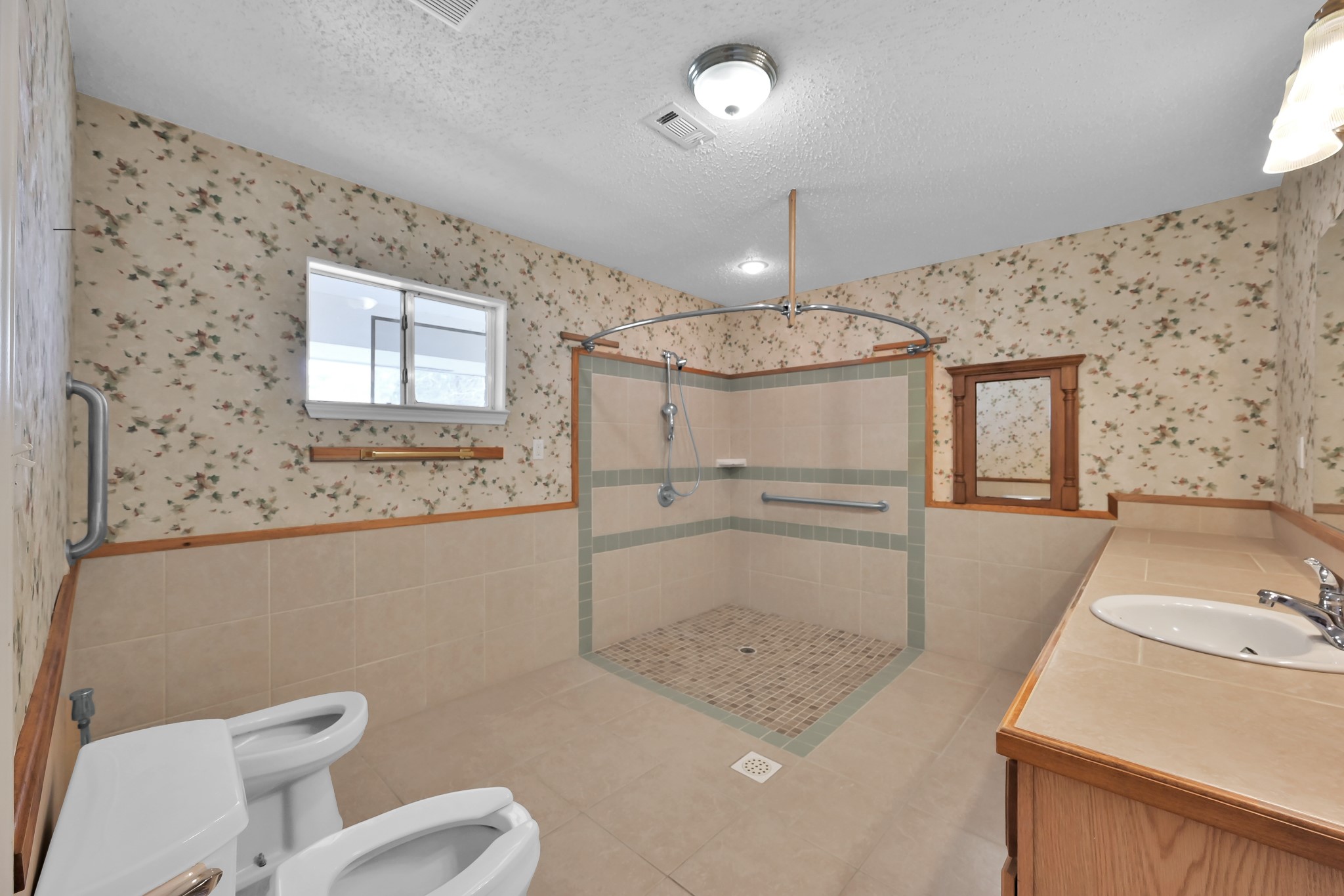 121 Magnolia Boulevard New Caney, TX 77357 - Photo 19 of 39 a bathroom with a sink a toilet and shower