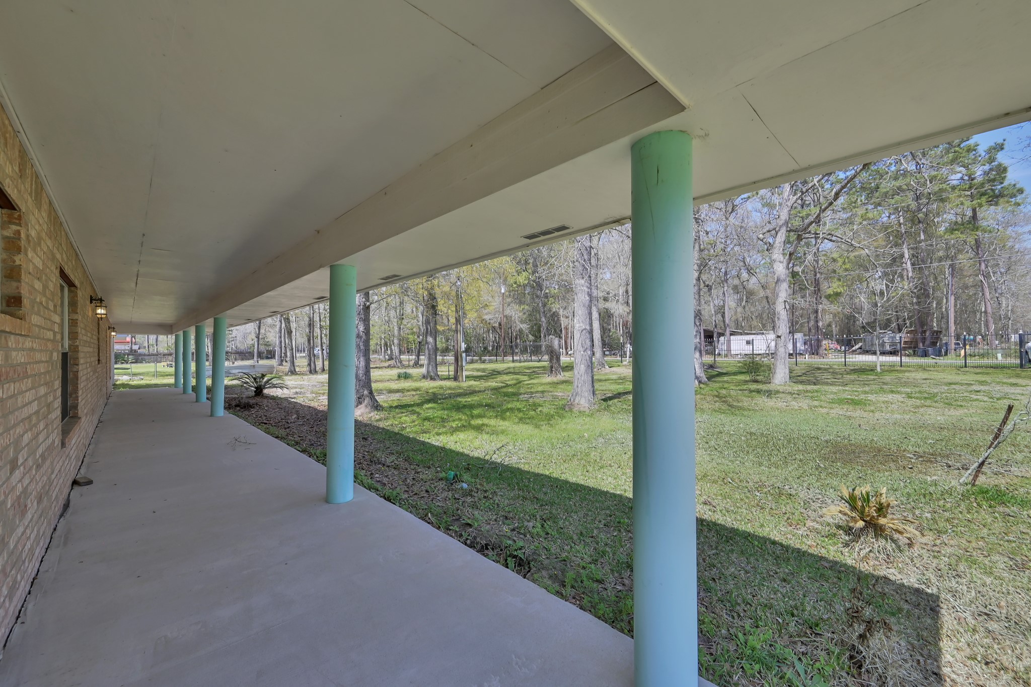 121 Magnolia Boulevard New Caney, TX 77357 - Photo 2 of 39 a view of a house with backyard from a corridor
