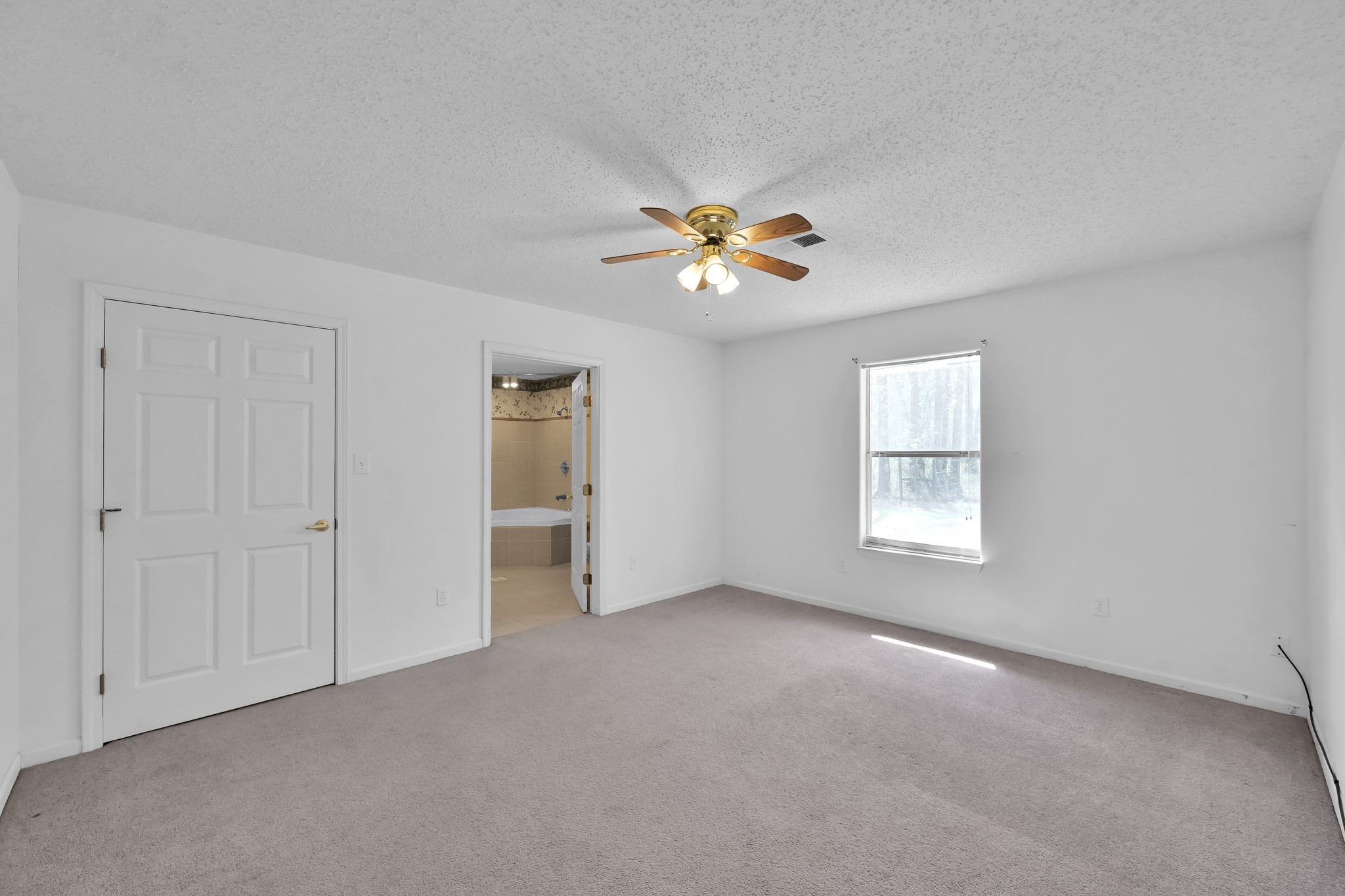 121 Magnolia Boulevard New Caney, TX 77357 - Photo 23 of 39 a view of an empty room with a window