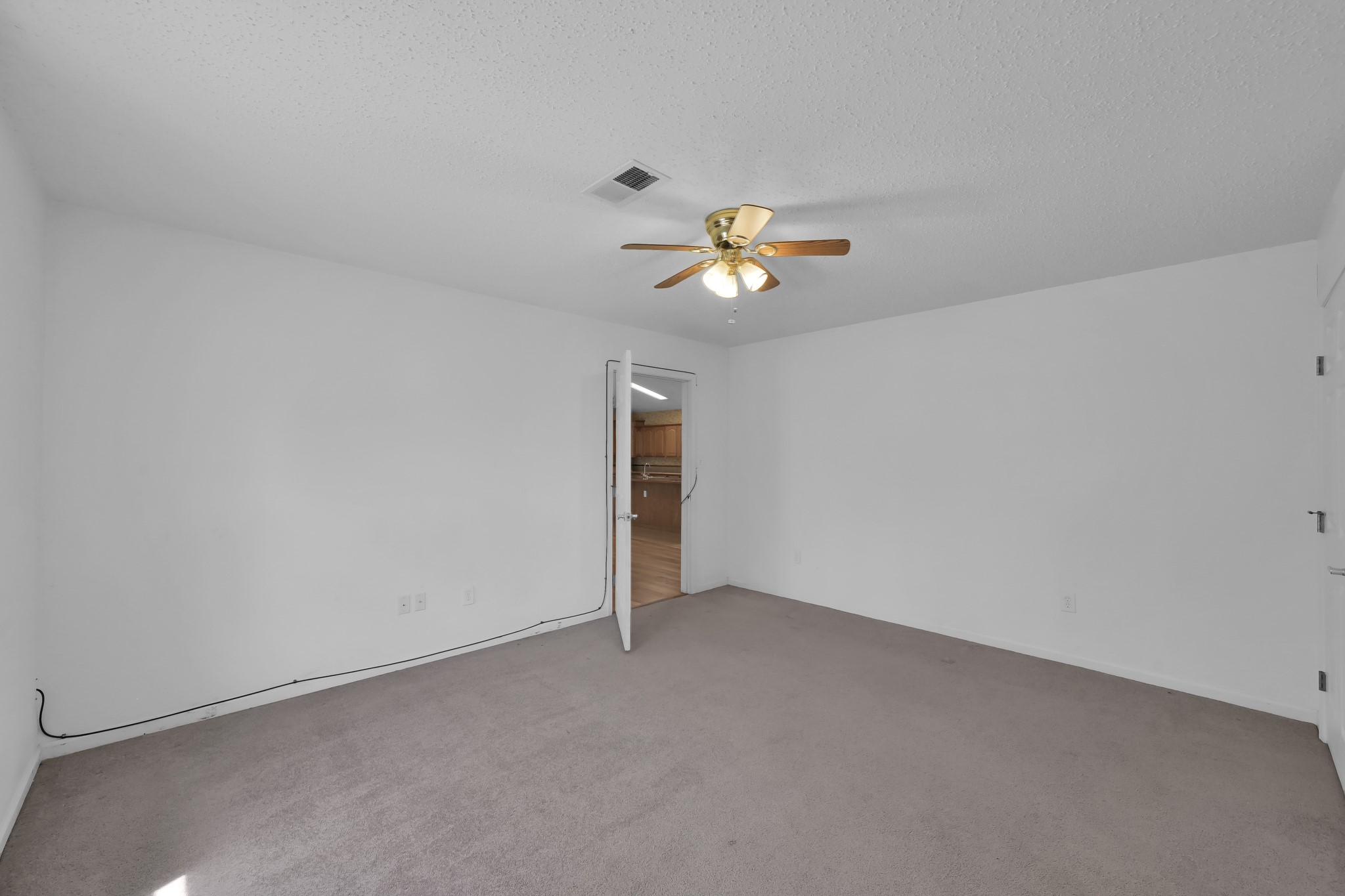 121 Magnolia Boulevard New Caney, TX 77357 - Photo 24 of 39 an empty room with a window and a ceiling fan
