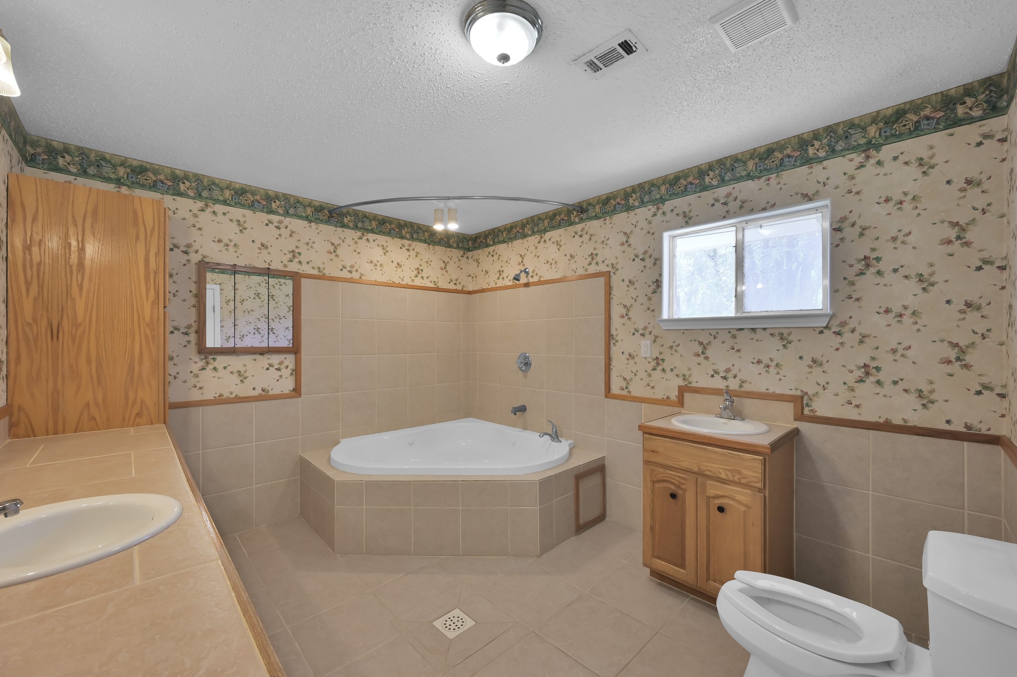 121 Magnolia Boulevard New Caney, TX 77357 - Photo 26 of 39 a bathroom with a sink a toilet and shower