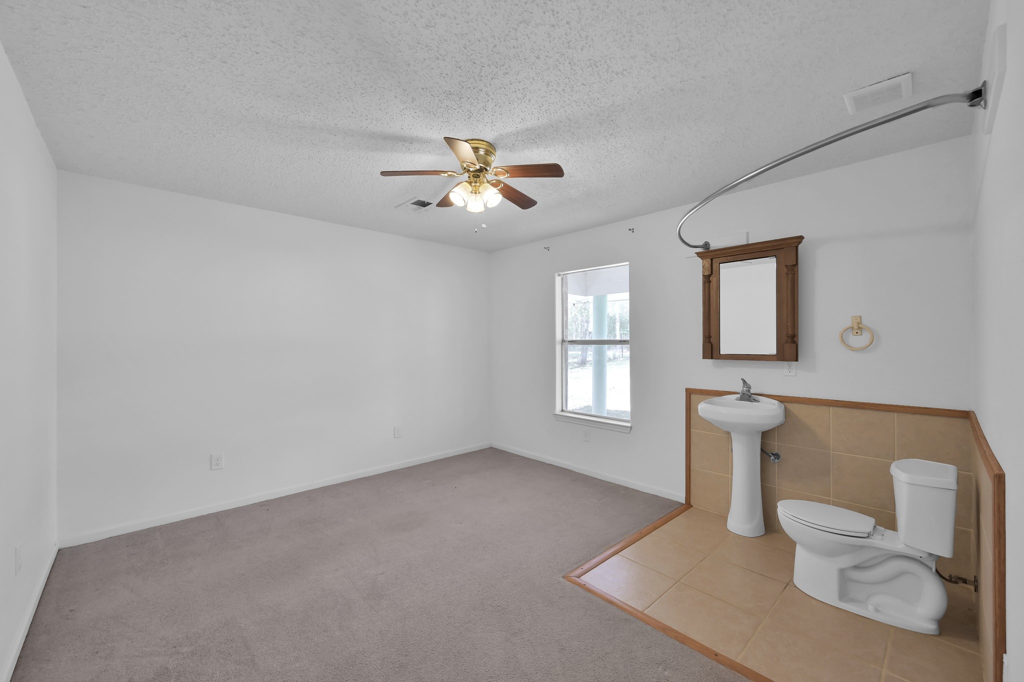 121 Magnolia Boulevard New Caney, TX 77357 - Photo 29 of 39 a view of an empty room with a window