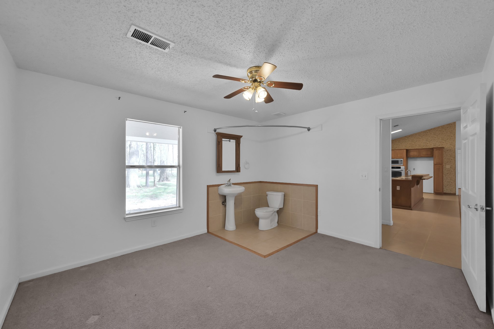 121 Magnolia Boulevard New Caney, TX 77357 - Photo 30 of 39 a living room with furniture and a chandelier