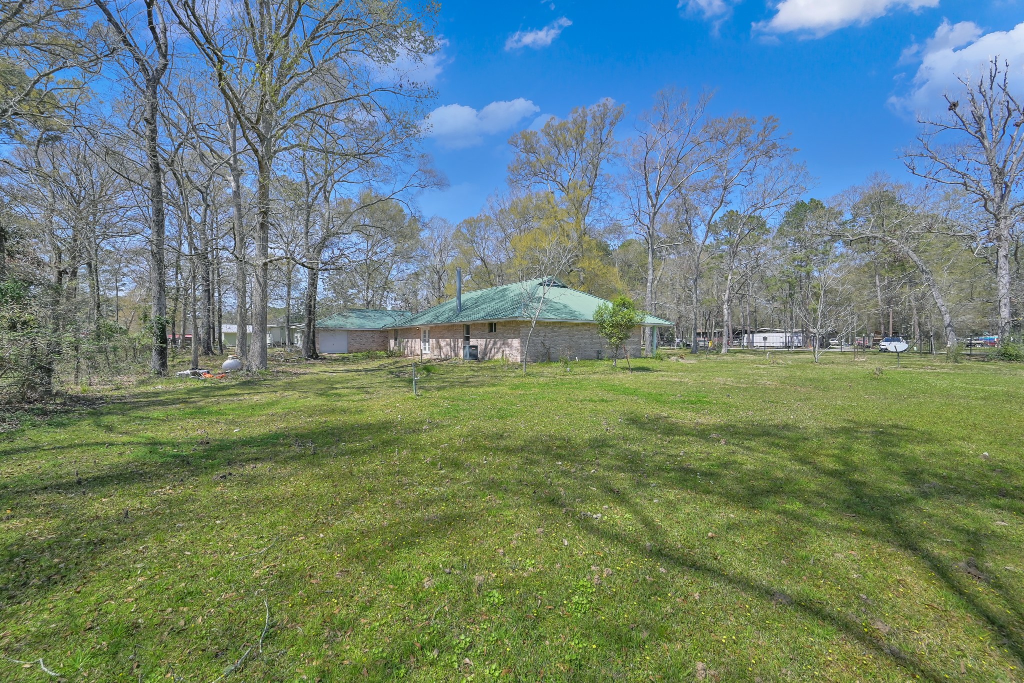 121 Magnolia Boulevard New Caney, TX 77357 - Photo 36 of 39 a view of building with outdoor space