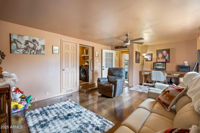 a bed room with furniture and a flat screen tv