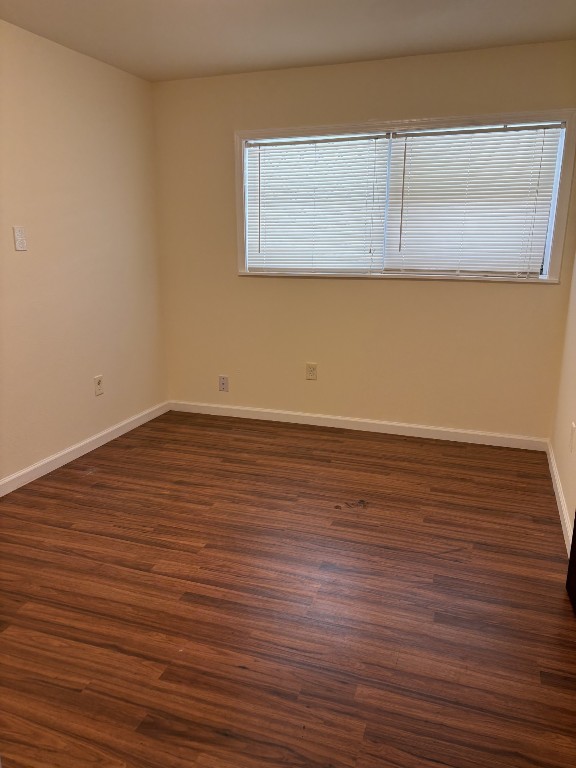 7220 Avenue R Galveston, TX 77551 - Photo 5 of 8 a view of an empty room with wooden floor