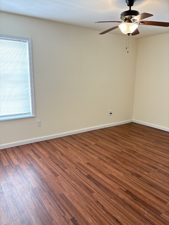 7220 Avenue R Galveston, TX 77551 - Photo 6 of 8 wooden floor in an empty room with a window