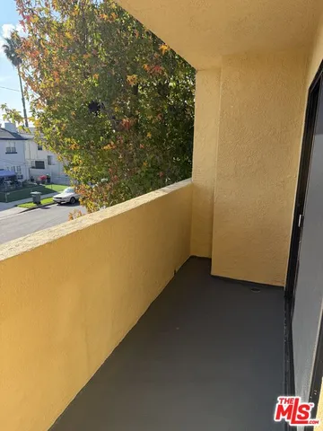 a view of a balcony with an outdoor space