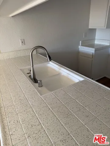 a bathroom with a sink and mirror