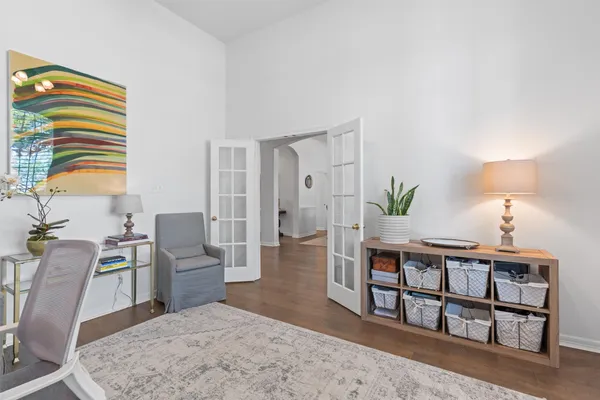 a living room with furniture wooden floor and a flat screen tv