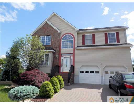24 Lexington Road Monmouth Junction, NJ 08852 - Photo 1 of 21 a front view of a house with a garden