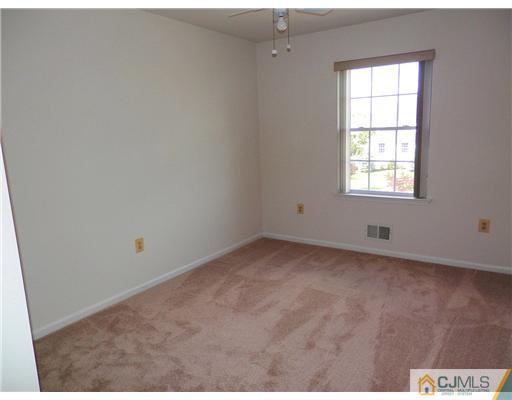 24 Lexington Road Monmouth Junction, NJ 08852 - Photo 13 of 21 an empty room with a window
