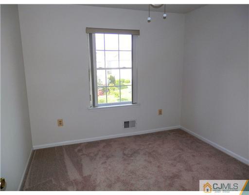 24 Lexington Road Monmouth Junction, NJ 08852 - Photo 14 of 21 an empty room with a window