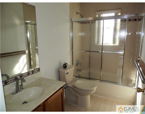 24 Lexington Road Monmouth Junction, NJ 08852 - Photo 15 of 21 a bathroom with a sink toilet and shower