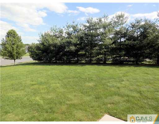 24 Lexington Road Monmouth Junction, NJ 08852 - Photo 19 of 21 a view of a green yard