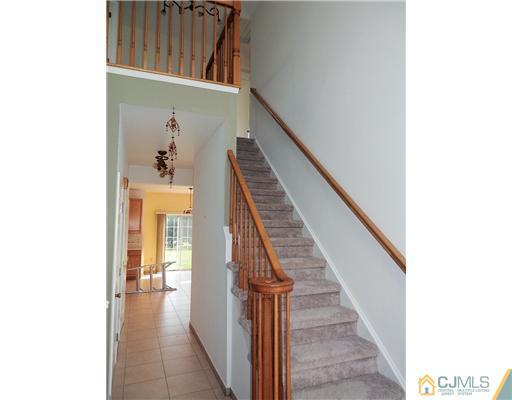 24 Lexington Road Monmouth Junction, NJ 08852 - Photo 4 of 21 a view of entryway and hall with wooden floor
