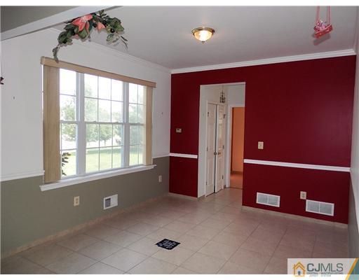24 Lexington Road Monmouth Junction, NJ 08852 - Photo 5 of 21 a view of an empty room with a window