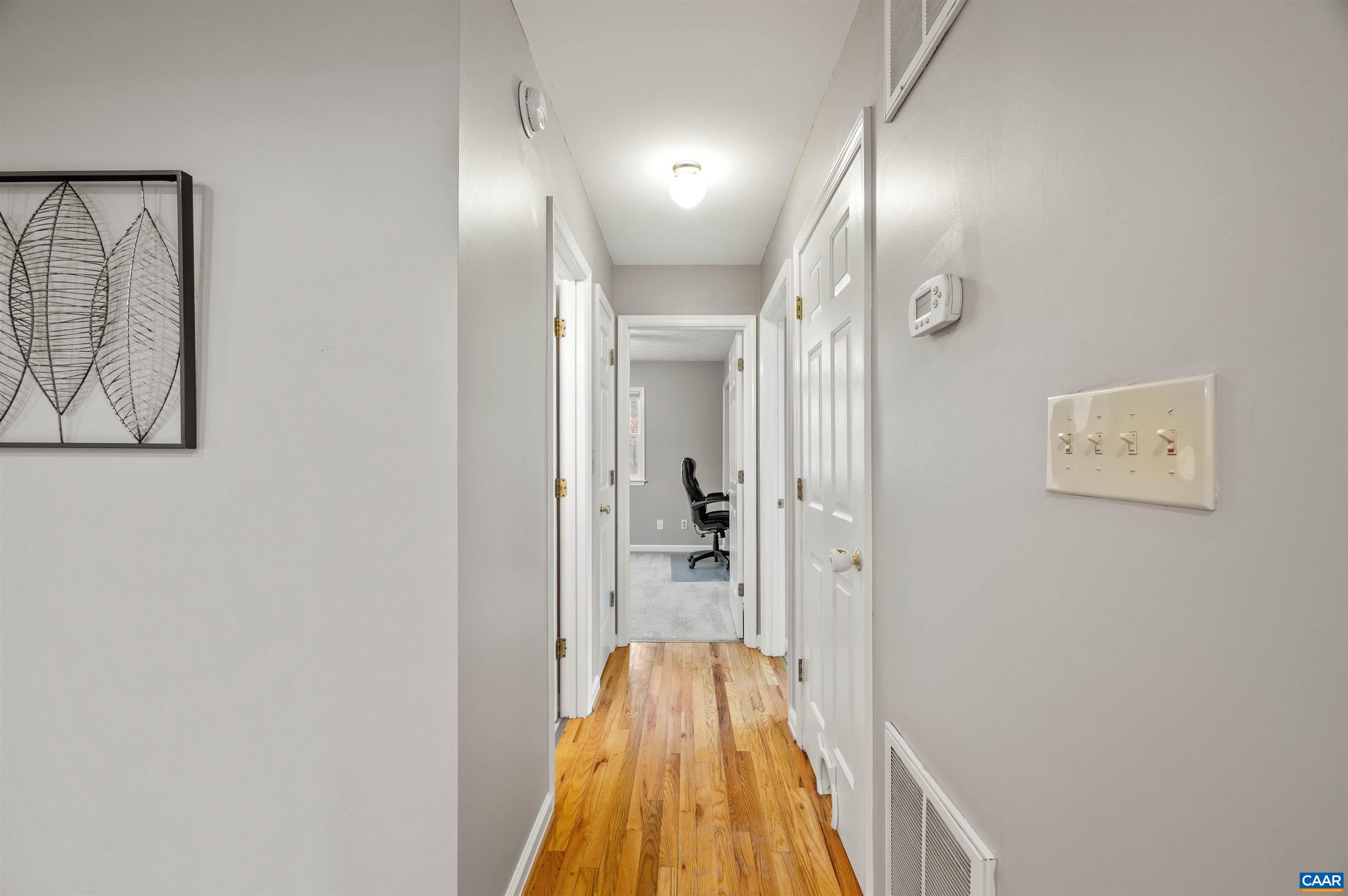 139 Fox Hollow Road Ruckersville, VA 22968 - Photo 16 of 54 a view of a hallway with a chandelier