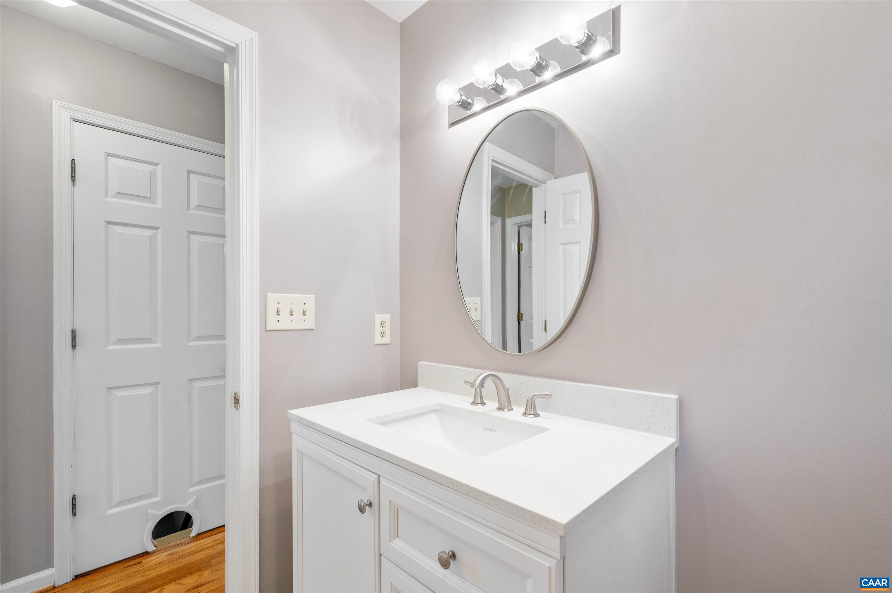 139 Fox Hollow Road Ruckersville, VA 22968 - Photo 18 of 54 a bathroom with a sink and a mirror