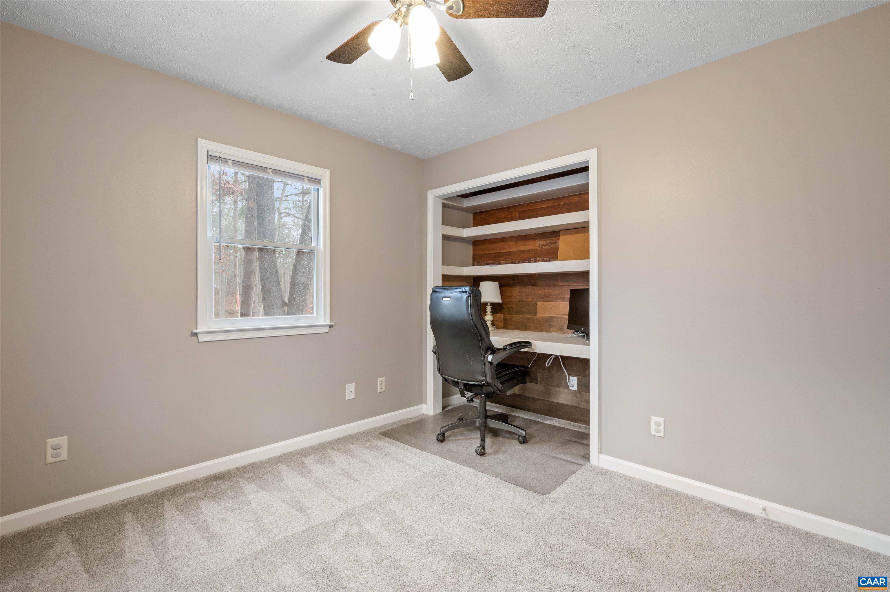 139 Fox Hollow Road Ruckersville, VA 22968 - Photo 20 of 54 a view of a workspace with furniture and a window