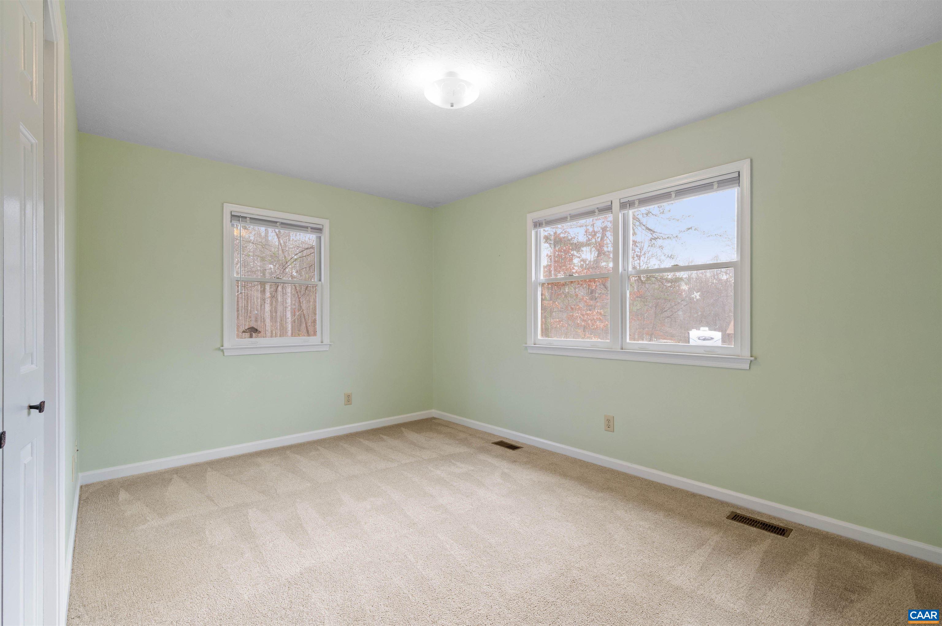 139 Fox Hollow Road Ruckersville, VA 22968 - Photo 22 of 54 a view of empty room with windows