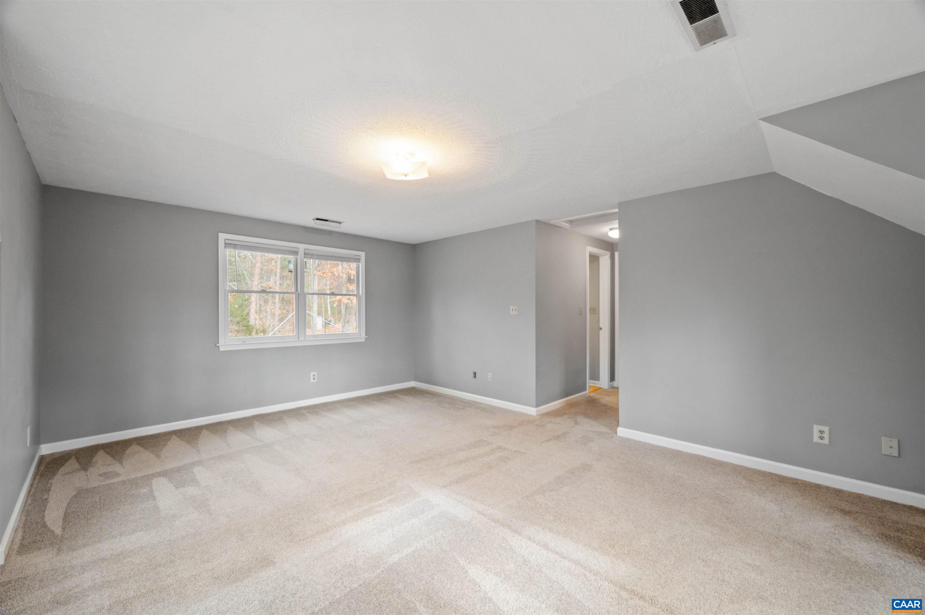 139 Fox Hollow Road Ruckersville, VA 22968 - Photo 30 of 54 an empty room with windows