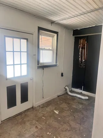 a view of an empty room with window