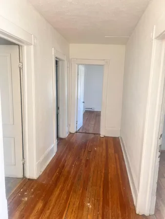 a view of a bedroom from a hallway