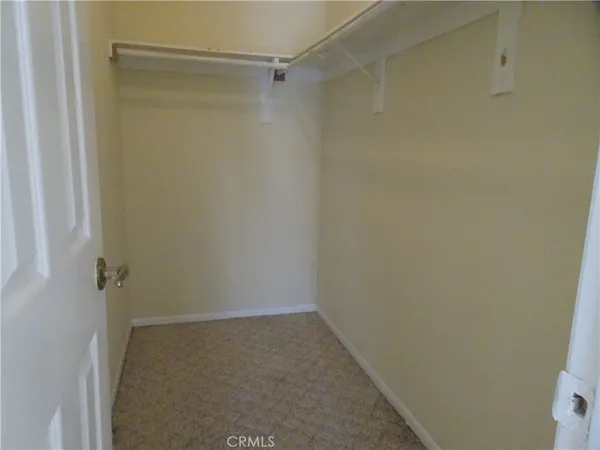 a view of empty room with floor to ceiling window