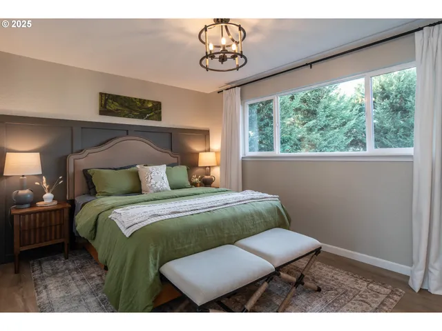 a bed room with a bed and a window