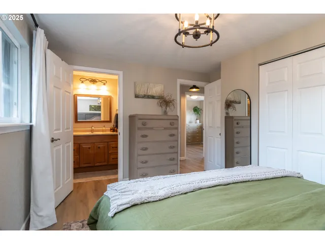 a view of a bedroom with closet and cabinet