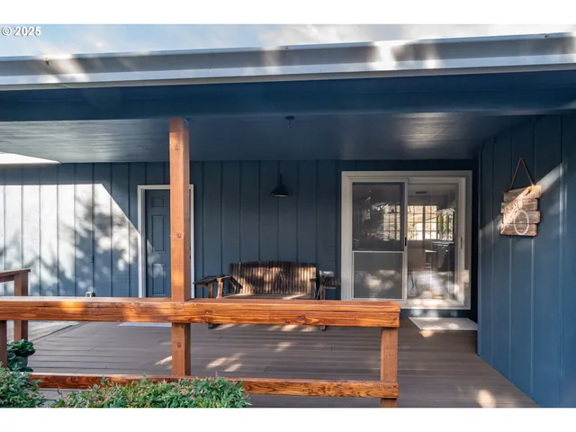 a view of living room with furniture and window