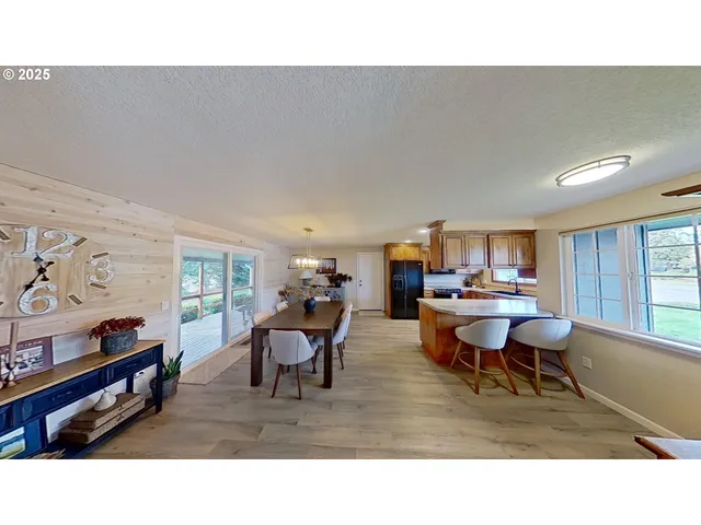 a living room with furniture a window and a flat screen tv