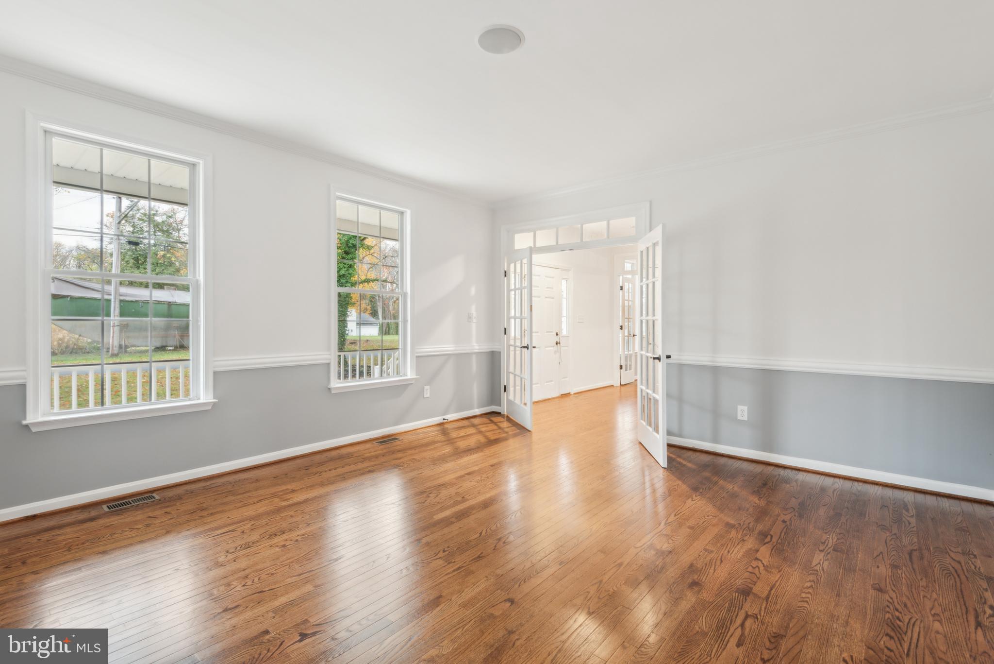 1825 Johnson Road Annapolis, MD 21409 - Photo 5 of 44 a view of empty room with wooden floor and fan