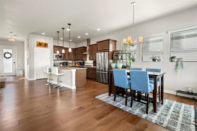 a view of a dining room with furniture window and wooden floor