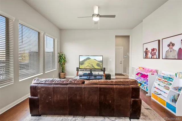 a living room with furniture and window