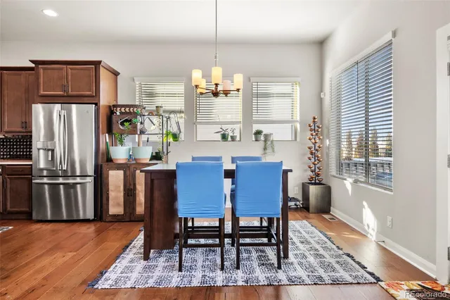 a view of a dining room with furniture window and wooden floor