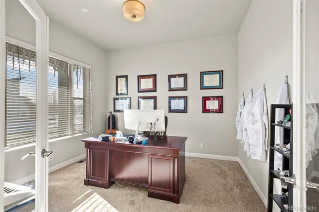 a living room with furniture and window