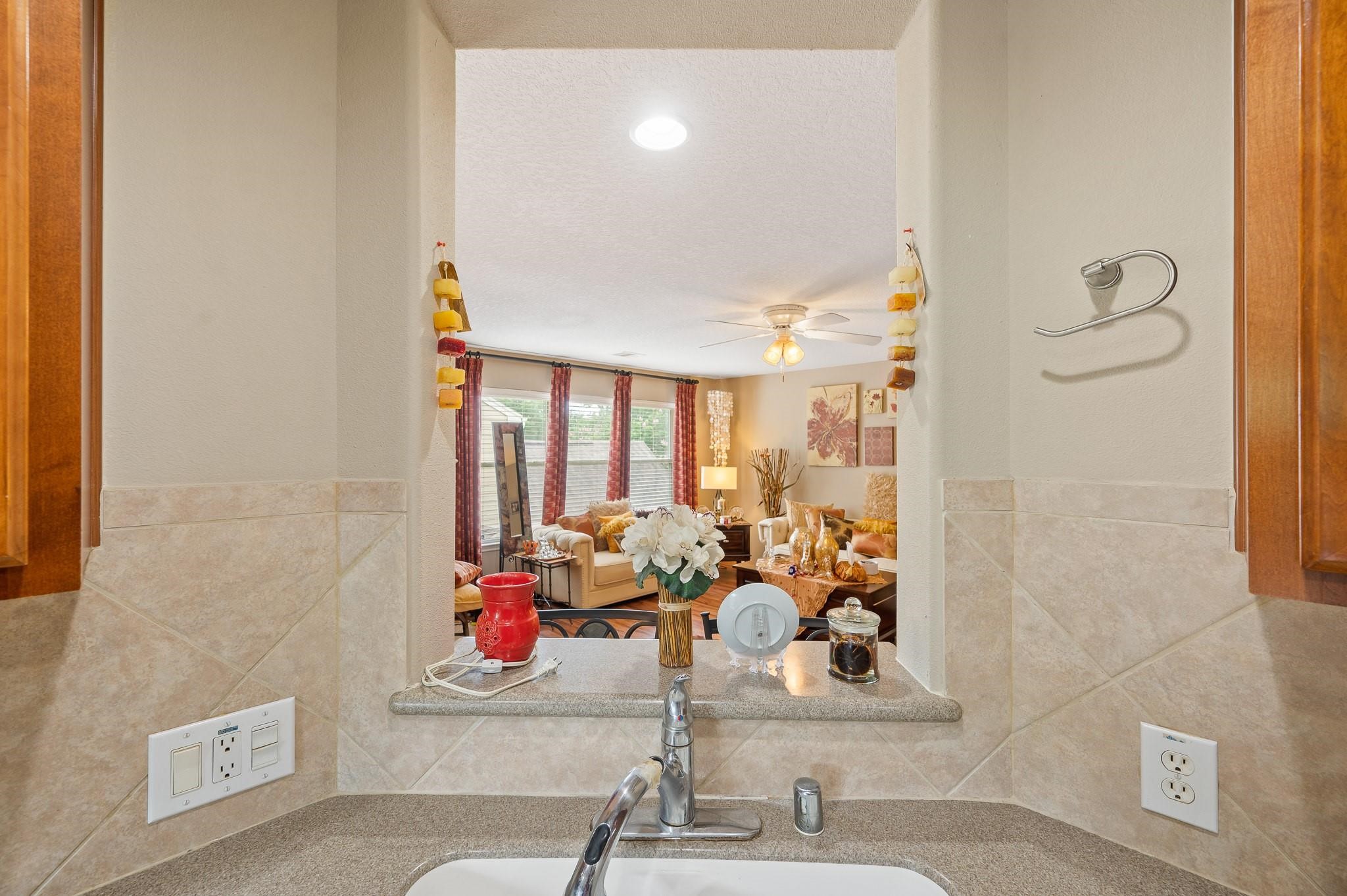 13600 Breton Ridge Street, Unit 25E Houston, TX 77070 - Photo 13 of 39 a room with a chandelier