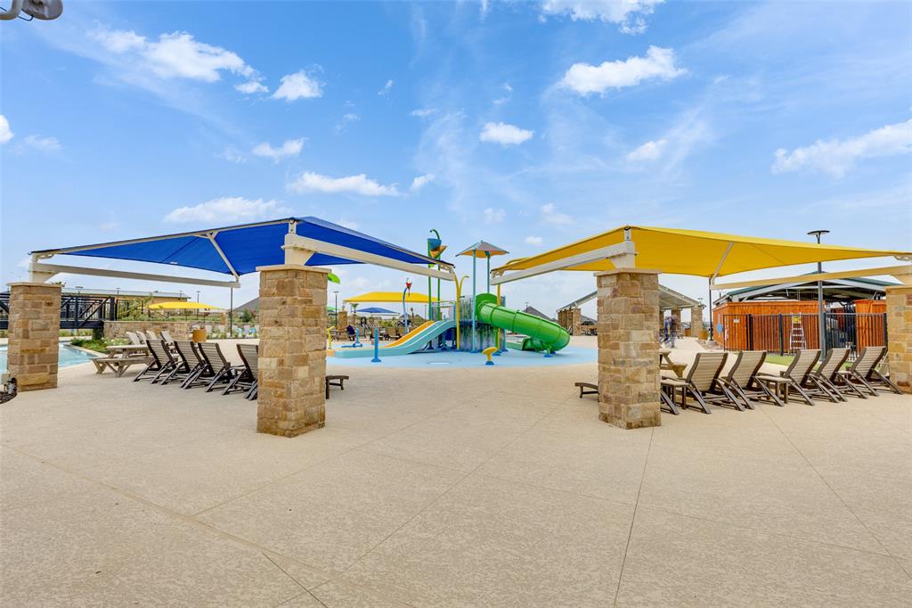 208 Orange Road Buda, TX 78610 - Photo 25 of 31 Family-friendly fun awaits at this vibrant community splash pad, complete with water slides and shaded lounge areas.