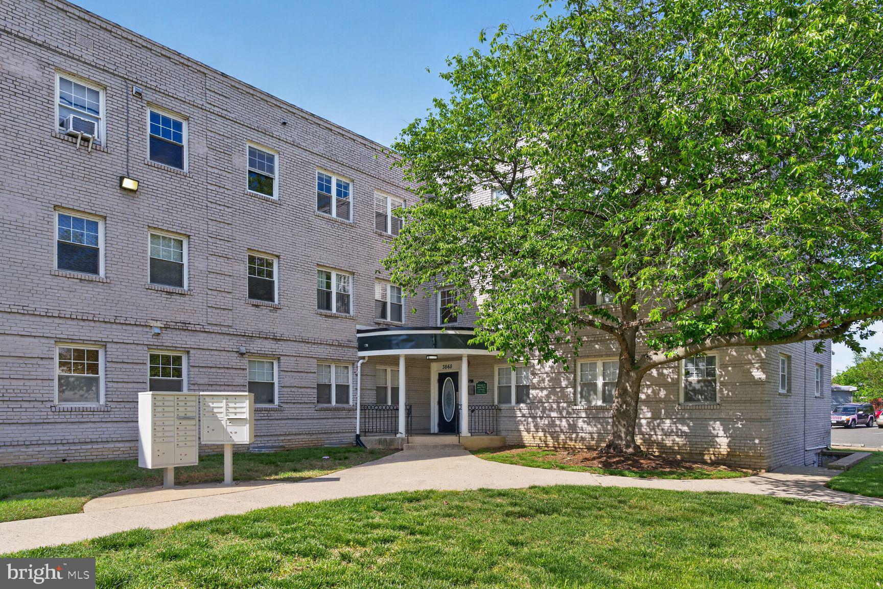 3868 9th Street Southeast, Unit 301 Washington, DC 20032 - Photo 16 of 16 front view of a house with a yard