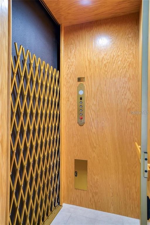 592 Bella Loop Dunedin, FL 34698 - Photo 20 of 25 a bathroom with a shower curtain and a sink