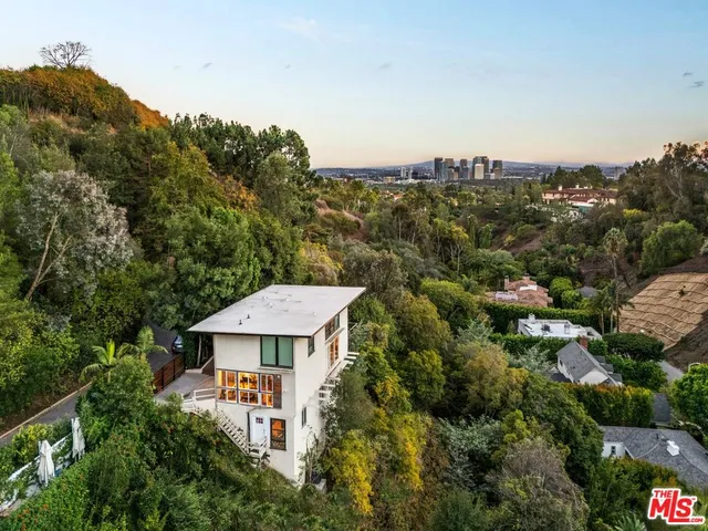 an aerial view of a house with a garden