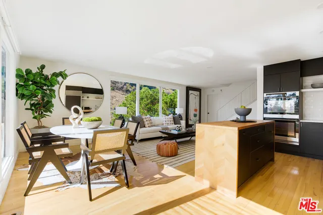 a view of a dining room with furniture window and outside view